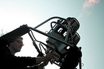 testing the burners of the hot air balloon